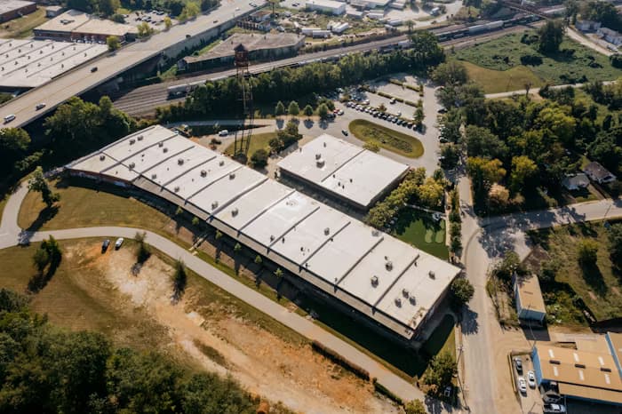 Commercial TPO membrane re-roof on a flat-roof building in Provo, Utah